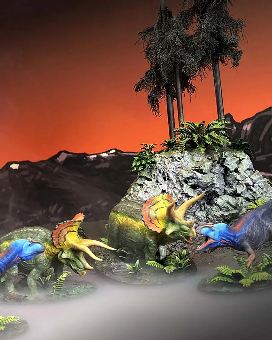 Painted Triceratops facing a raptor pack
